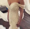 2019 Fabulous Mermaid Wedding Dresses Luxury Pearls Beading Fit and Flare Trumpet Bridal Gowns Tulle Skirt Off Shoulder robes de soirée