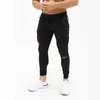 2019 Pantalones de chándal deportivos informales para hombres Gimnasios Pantalones de chándal ajustados de algodón elástico para hombres Pantalones de entrenamiento delgados con LOGOTIPO bordado