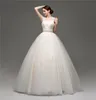 Superbes robes de mariée champagne robe de bal plis accrocheurs Tulle avec appliques dentelle robes de mariée Peplum