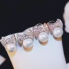 Coreano di lusso zircone arco gioielli orecchino di perla femminile di alta qualità S925 argento pin 18k orecchini placcati oro semplici orecchini raffinati