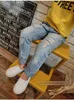 Jeans Pantalons en denim pour enfants 2018 nouvelle mode bébé garçons filles personnalité trou givré jeans extensibles vêtements pour enfants livraison gratuite