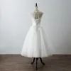 2022 Photo réelle longueur de thé robe de mariée courte pas cher col transparent avec dentelle Applique Cap manches courtes Corset dos Tulle mariage de style campagnard