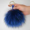 Véritable porte-clés en fourrure argent renard cheveux pompon charme bijoux porte-clés sac charme moelleux fourrure porte-clés charme