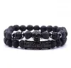 Gran oferta 2 unids/set color negro cabeza de calavera Lava turquesa cuentas de piedra Natural hombres pulsera conjunto de joyería brazaletes con dijes