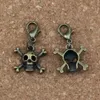 100 Pz / lotto Lega di bronzo antico Teschio scheletro osso Charms Perlina con chiusura a moschettone Misura il braccialetto di fascino Gioielli fai da te 16.5x39mm A-337b