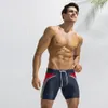 セクシーな水着の男性水泳幹の男性の水着夏の水着はショートパンツのブリーフを着る