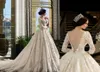 Underbara Långärmade Bröllopsklänningar Sheer Backless Sexig Tulle och Lace Bröllopsklänning Count Tåg Anpassade Bröllopklänningar 3D Appliques