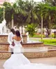 Afrikanische Brautkleider in Übergröße, Spaghettiträger, Spitzenapplikationen, Perlenstickerei, Meerjungfrauen-Hochzeitskleid mit abgestuftem Tüll, lange Brautkleider