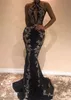 Sexy Black Evening Dresses With Silver Applique Halter Sleeves Mermaid Prom Gowns Backless Sequined Sweep Train Custom Made Formal Gown