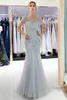 New Designer 2019 Sexy Gold Gray Mermaid Prom Dresses Beads Crystals Bling Bling V Back Sheer Neck Tiered Tulle Floor Length Evening Gowns