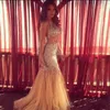 Sexy Bling Mermaid Prom Dresses Deep V Neck Halter Crystal Beaded Tulle See Through Backless Nude Evening Party Gowns Pageant Dresses