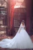 Masowe aplikacje tiulowe koronkowe ukochane z ramionami suknie ślubne Suknie ślubne