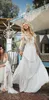 Plażowe vintage bohemijskie sukienki głębokie v szyja koronkowe aplikacje krótkie rękawy ślubne suknie ślubne szyfonowe pociąg boho sukienka ślubna