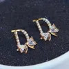 D-Letter Brand Stud-oorbellen Geplaatste 18K gouden micro-set zirkoon boog knoop high-end oorbellen Koreaanse mode zoete vrouwen voortreffelijke oorbellen sieraden Valentijnsdag cadeau spc