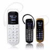 J8 Bluetooth Dialer Mini téléphone portable 0,66 pouces avec support mains libres Radio FM Micro carte SIM Réseau GSM avec emballage Livraison gratuite