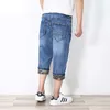 Heren jeans zomer mode mannen 3/4 lengte denim shorts broek harem hiphop elastische gescheurde broek plus size l-6xl1