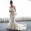 Anpassade långa ärmar spetsar sjöjungfru bröllopsklänningar 2023 med löstagbara tågapplikationer juvel hals steven khalil plus storlek brudklänningar