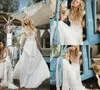 Abiti da sposa vintage Bohemian Beach 2018 Profondo scollo a V in pizzo con applicazioni maniche corte Abiti da sposa in chiffon Sweep Train Abito da sposa Boho