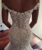 Sjöjungfru 2019 Nyaste bröllopsklänningar Sexiga av axeln Beaded Lace Appliqued Bridal Gowns Chapel Train Plus Size Vestidos