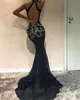 Sexy zwarte avondjurken met zilveren applique haltermouwen zeemeermin prom jurken backless lovertjes sweep trein op maat gemaakte formele jurk