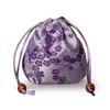 Mini kinesiska silke smycken påse satin blommig dragsko presentväska runt bottenförpackning väskor påsar 3pcs / parti