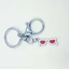 Быстрая доставка эмалированные очки / солнцезащитные очки брелок брелок брелок цепочка для ключей автомобиль ключ сувенирная пара сумка ключ цепочка A103