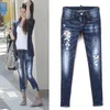 Young Woman Yellow Leather Patch Detail 5-Pocket Jeans Low Waist Trim Fit Denim Pants Cool Girls