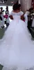 Underbara plusstorlek bröllopsklänning spetslock ärmar en linje strand brudklänningar med skärm tulle puffy kjol bröllopsklänningar