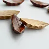 200pcs / много японского стиль древесина стенд держателя форма листа Палочка Rest стойки Art Craft Палочки держатель SN073