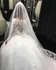 2018 Luxurious Arabic Ball Gown Wedding Dresses Sheer Scoop Neck Long Sleeves Lace Appliques Beaded Puffy Court Train Plus Size Bridal Gowns