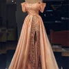 Erstaunliches Dubai Promi-Abendkleid, Perlen, Spitze, Applikationen, schulterfrei, kurzärmelig, Abendkleid, sexy, geteiltes Meerjungfrau-Abschlussballkleid mit Überrock