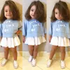 Kinderkleding lente en herfst meisje blauwe ronde kraag Lange mouwen T-shirt en witte korte rok pak twee stukken