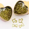 Tutu 50pcs/Lot Metal Material Bow Shape Paper Clip Gold Color grappig Kawaii Bookmark Office School Stationery Markering Clips H0037