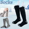 Elektrisch beheizte Socken mit wiederaufladbarem Akku für chronisch kalte Füße. Große USB-Lade-Heizsocken
