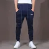 Męskie spodnie Nowy Marka Męskie Joggers Casual Harem Splupy Spodnie Spodnie Sportowe Mężczyźni Gym Dna Tor Training Spodnie joggingowe