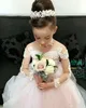 Ucuz Muhteşem Allık Pembe Çiçek Kız Elbise Uzun Illusion Kollu Sheer Boyun Sweep Tren Tül Yay Pageant Elbise Çocuklar Balo Parti Elbise