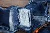 2021 Badge jeans män raka europeiska och amerikanska män hål patchduk snöflinga byxor plus storlek