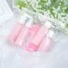 Hot 9PCS/Set Mini Makeup Refillable Travel Bottles Set Plastic Pressing Spray Bottle Makeup Tools Kit Face Cream Pot Bottles