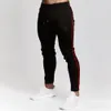 2018 ginásios exercício calças masculinas outono e inverno novo esporte calças fitness corredores calças costuradas de costura musculação sweatpants