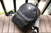 2018 new fashion Korean version M punk studded gold backpack men and women students bag travel backpack 02