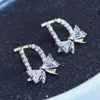 Boucles d'oreilles de pote de marque d-lettre plaquée 18k micro micro-ensemble zircon noeud boucles d'oreilles haut de gamme