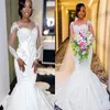 2020 African Long Sleeves Mermaid Wedding Dresses Jewel Neck Illusion Lace Appliques Crystal Beads Court Train Plus Size Formal Bridal Gowns