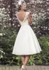 2017 elegantes vestidos de novia de longitud de té con cuello en V mangas casquillo apliques de encaje de tul bola vestido de novia vestidos de novia cortos