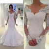 Abiti da sposa vintage a sirena in pizzo con scollo a V maniche lunghe Applique con perline Abiti da sposa arabi senza schienale Abiti da sposa