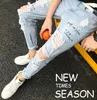 Pants male Korean version of the trend summer hole jeans men's slim straight wild boys nine pants 9 points