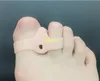 100 París/lote Gel de silicona Corrector de pulgar Hallux Valgus Dispositivo de órtesis ósea del pie cuidado de los pies aparato de doble anillo soporte