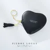 Nouveau porte-monnaie en cuir PU pour femmes porte-clés en forme de coeur de dessin animé mignon porte-clés porte-monnaie cadeau avec gland, taille 4.3 * 4 pouces
