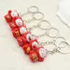 2018 Nyckelkedja Lovely Cartoon Maneki Neko Lucky Cat Mini Plastic Toy Keychain för Barngåva Purse Charms Pendant Key Ring