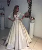 2019 Beach Wedding Gowns Ivory and Champagne V Neck Sheer 3/4 Long Sleeves Waist Ribbon Court Train Pearls Buttons Closure Bridal Gowns