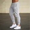 Nouvelle marque alphalete hommes pantalons décontracté coton élastique hommes gymnases Fitness pantalons d'entraînement pantalon de survêtement maigre pantalon survêtement